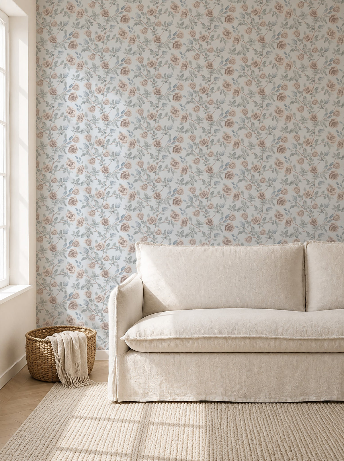 Dusty blue wallpaper with blush roses in a cozy living room setting.