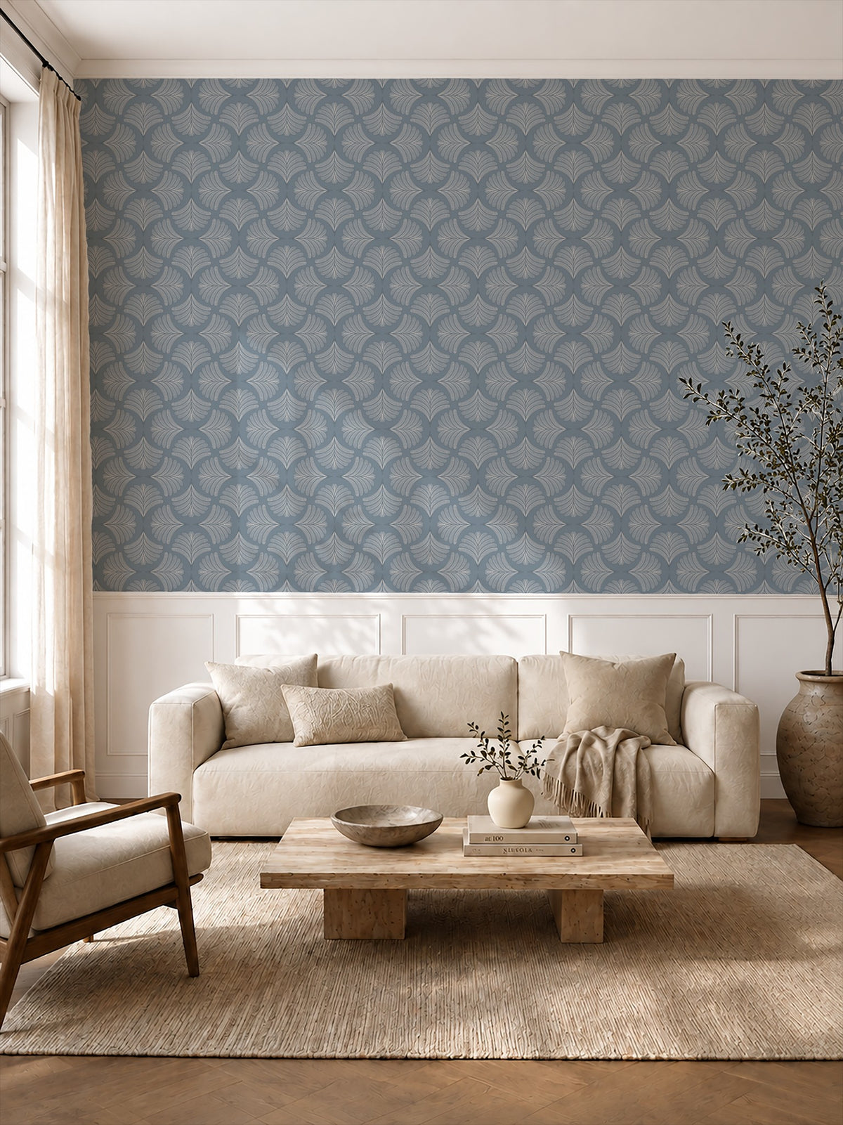 Moody blue palm fan wallpaper in elegant living room with beige sofa and wooden table.