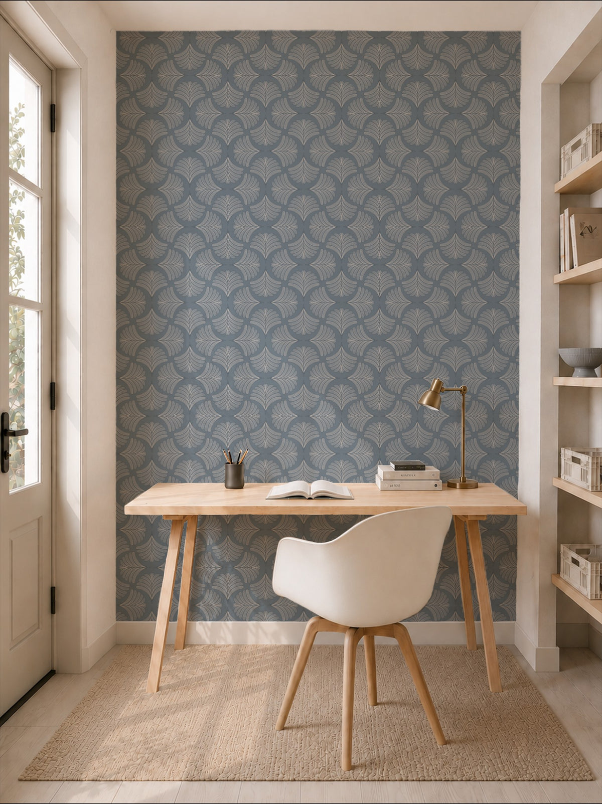 Palm fans moody blue wallpaper in a modern home office setting with a wooden desk and white chair.