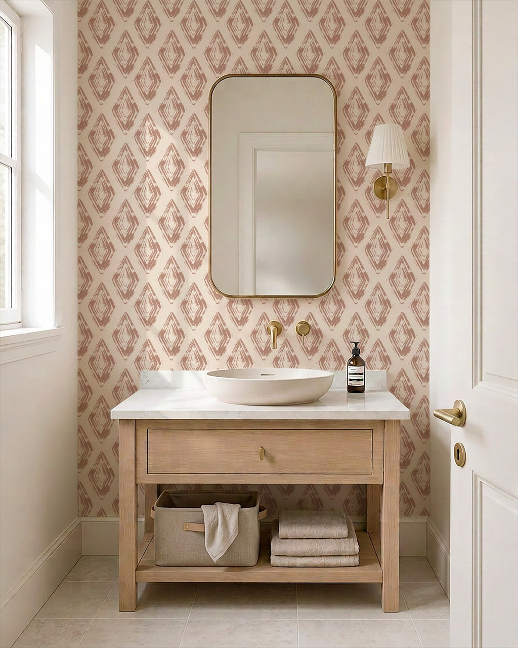 Rose clay diamond block print wallpaper in elegant bathroom with wooden vanity.