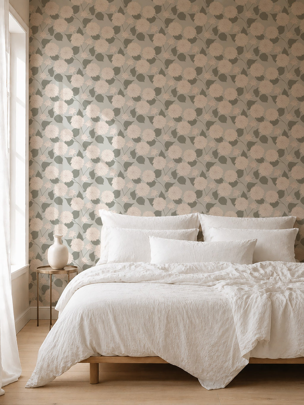 Sage and cream dahlia floral wallpaper in serene bedroom setting with white bedding.