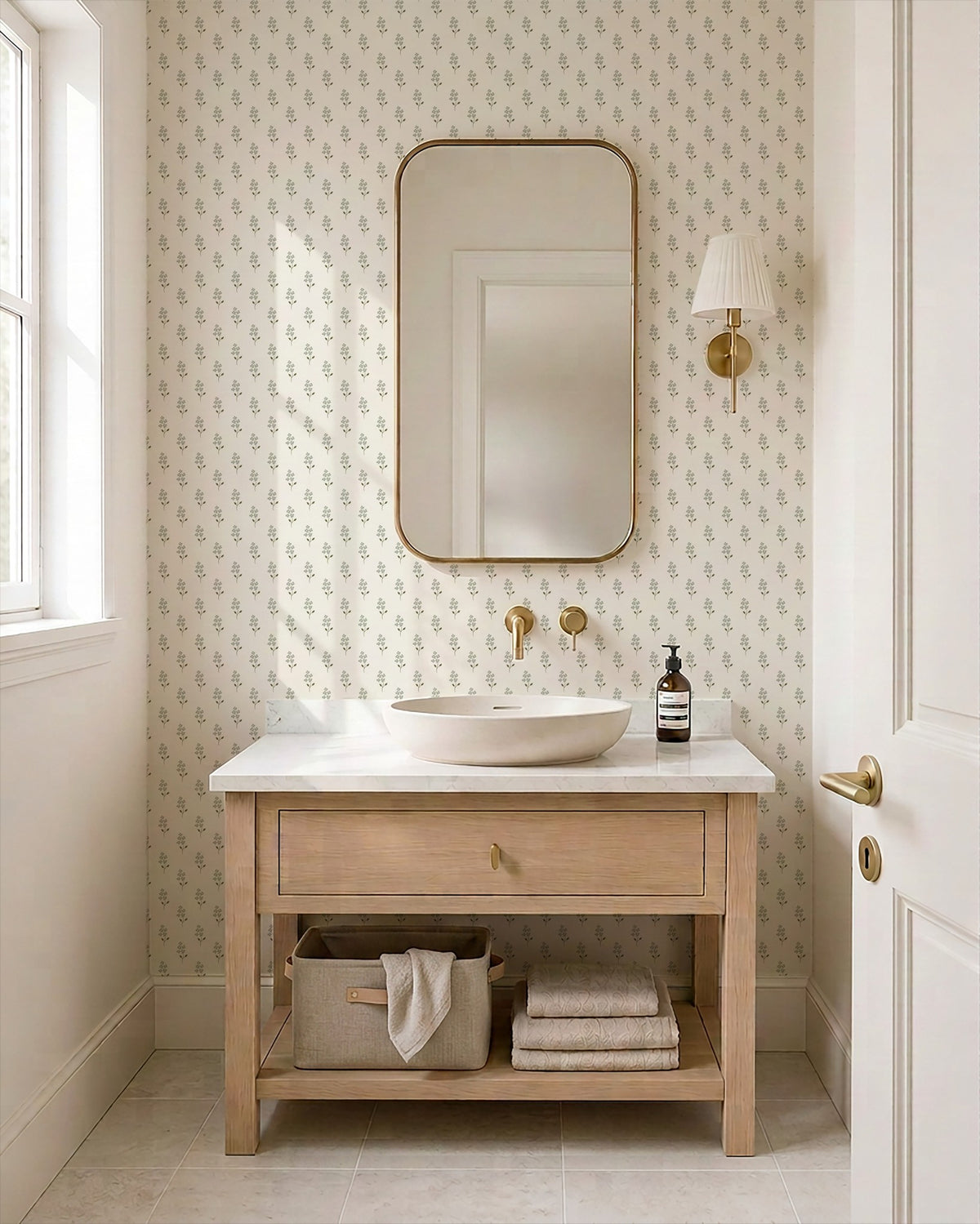 Sage green floral wallpaper in a serene bathroom with light wood vanity and mirror.