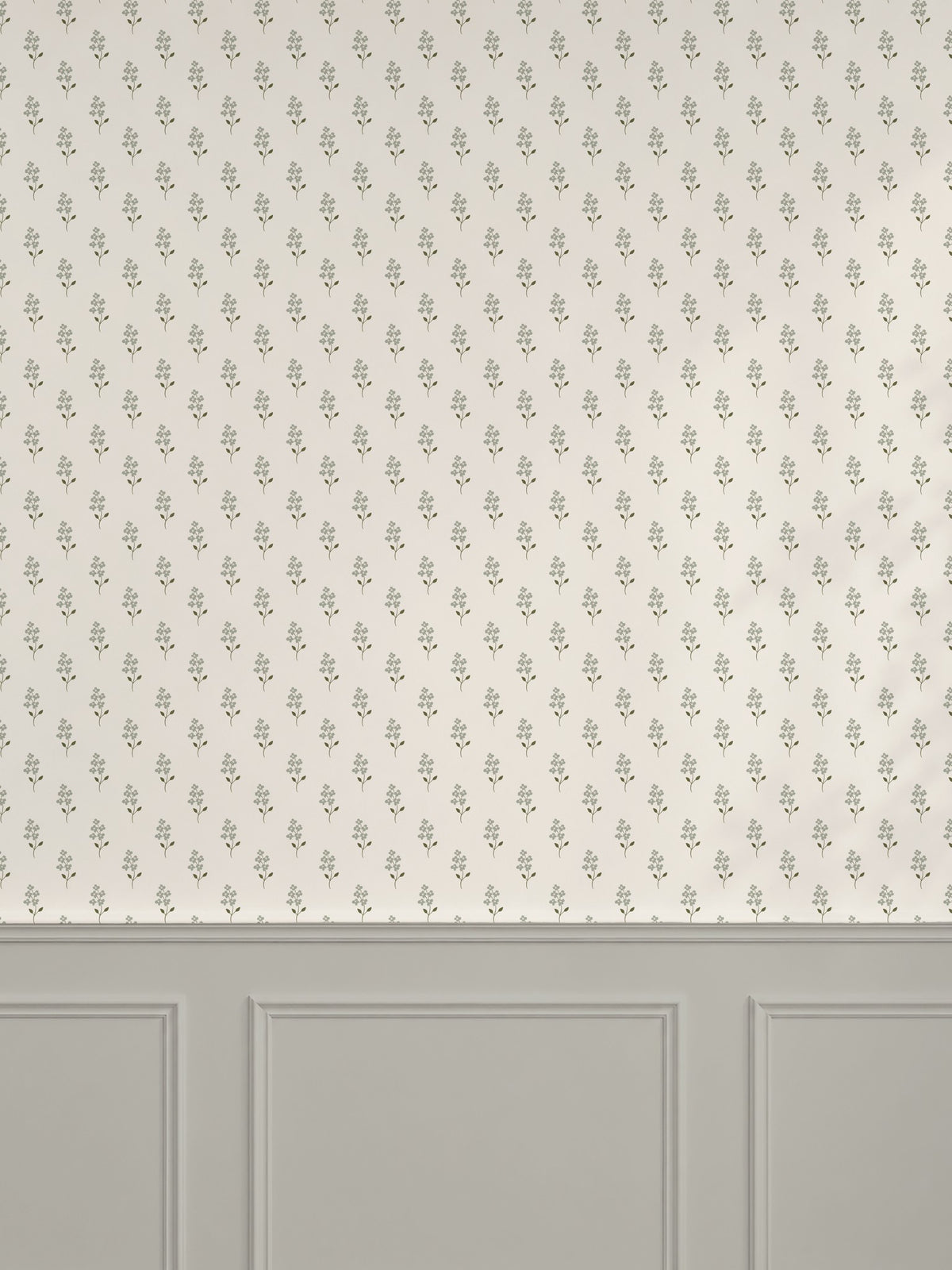 Sage green floral wallpaper with cream background in elegant room setting.