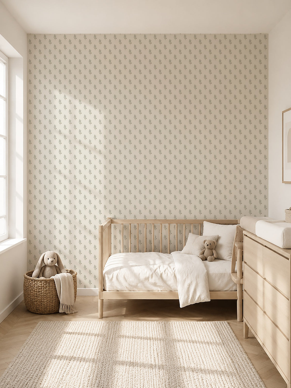 Sage green floral wallpaper in a cozy nursery with wooden furniture.