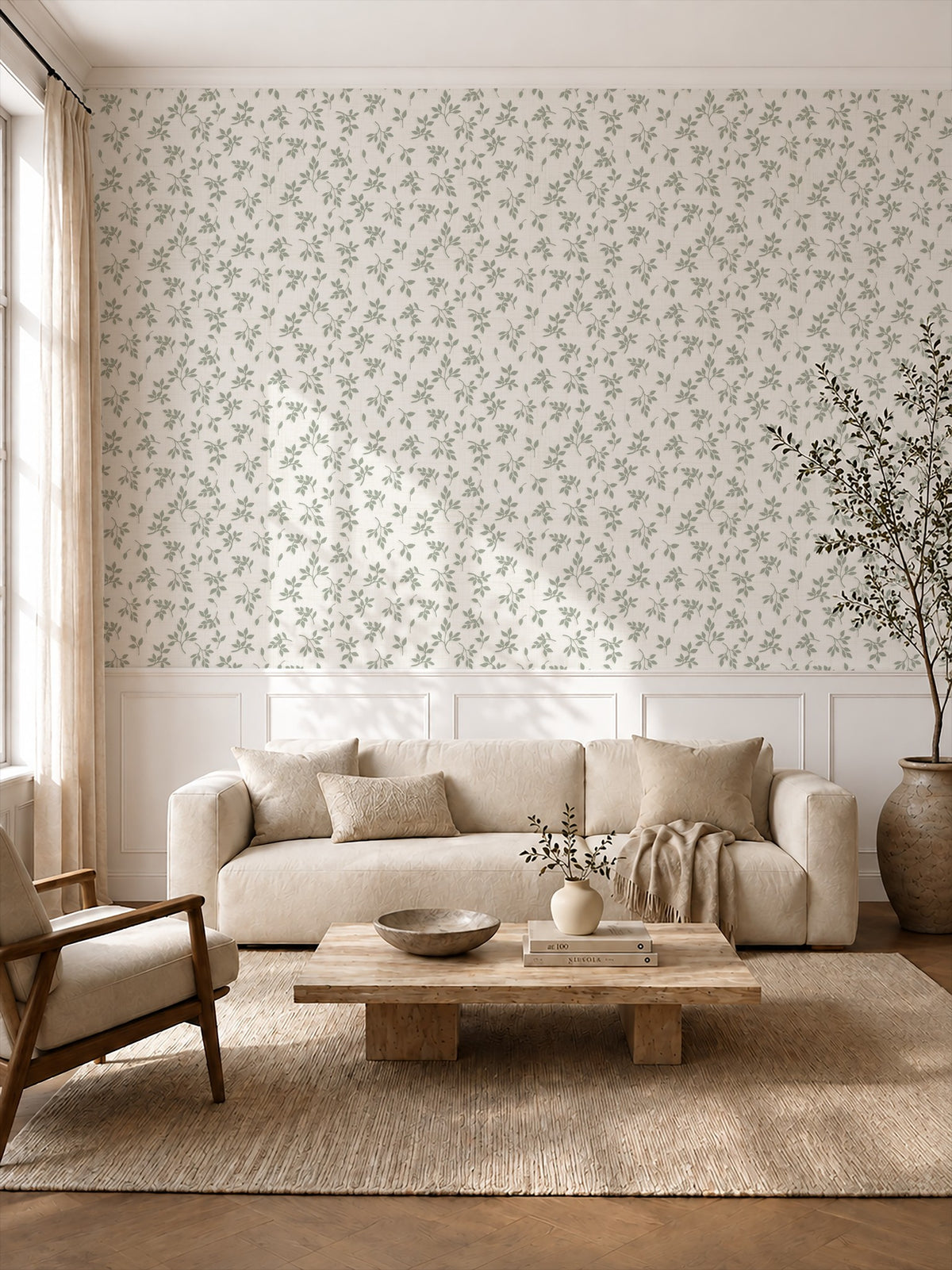 Sage green leaf sprig wallpaper in a cozy living room with natural wood furnishings.