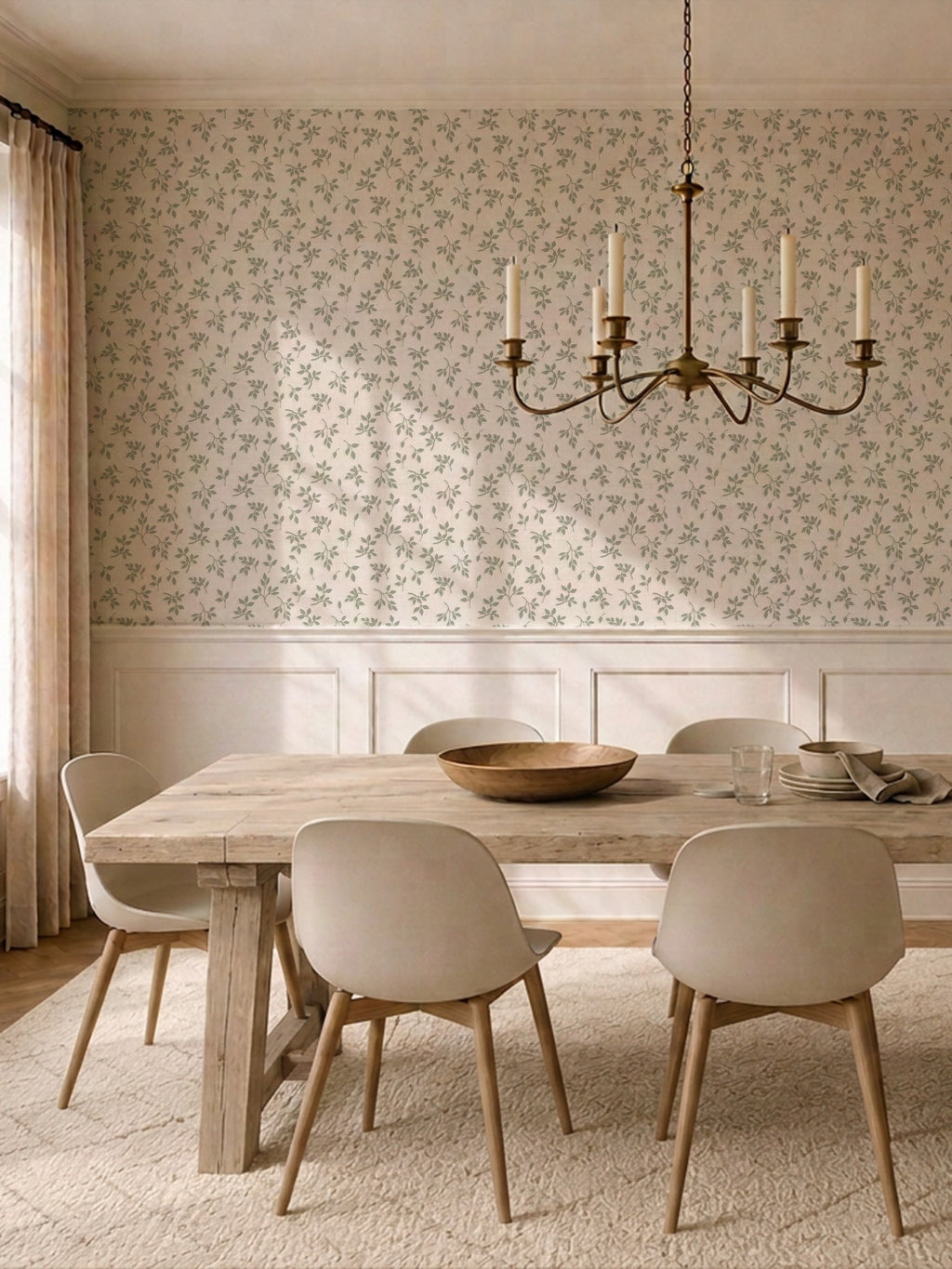 Sage green leaf sprig wallpaper in elegant dining room with wooden table and chairs.